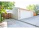 Garage with a large door and parking for two cars at 3241 Sheridan Blvd, Wheat Ridge, CO 80212