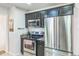 Modern kitchen featuring stainless steel appliances and ample counter space at 3241 Sheridan Blvd, Wheat Ridge, CO 80212