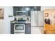 Stylish kitchen with stainless steel appliances and great storage at 3241 Sheridan Blvd, Wheat Ridge, CO 80212