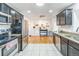 Well-equipped kitchen with stainless steel appliances, granite countertops, and ample cabinet space at 3241 Sheridan Blvd, Wheat Ridge, CO 80212