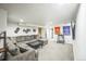 Spacious living room with a large sectional sofa and media setup at 3241 Sheridan Blvd, Wheat Ridge, CO 80212