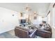 Inviting living room with comfortable seating and a staircase to the second floor at 3241 Sheridan Blvd, Wheat Ridge, CO 80212