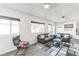Inviting living room features a large window, two sofas and a modern rug at 3241 Sheridan Blvd, Wheat Ridge, CO 80212