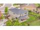 Aerial view of a beautiful home featuring a large backyard, covered patio, and lush landscaping at 1920 Pioneer Cir, Lafayette, CO 80026