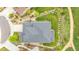 Aerial view of a well landscaped property, with a stone patio and walkway surrounding the home at 1920 Pioneer Cir, Lafayette, CO 80026