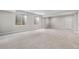 Spacious finished basement with plush carpeting, neutral paint, egress windows, and recessed lighting at 1920 Pioneer Cir, Lafayette, CO 80026