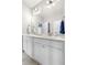 This bathroom features a double vanity with a large mirror and ample storage at 1920 Pioneer Cir, Lafayette, CO 80026