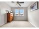 The bedroom boasts natural light from two windows and a classic wooden dresser at 1920 Pioneer Cir, Lafayette, CO 80026