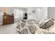 Cozy bedroom with neutral carpet, gray walls, patterned bedding, and natural light streaming through sheer curtains at 1920 Pioneer Cir, Lafayette, CO 80026