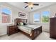 The bedroom features a cozy bed, a wooden dresser, and natural light from the window at 1920 Pioneer Cir, Lafayette, CO 80026