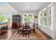 Formal dining room with large windows, hardwood floors, an elegant chandelier, and seating for eight at 1920 Pioneer Cir, Lafayette, CO 80026