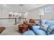 The cozy living room features comfortable seating and a view of the stairwell at 1920 Pioneer Cir, Lafayette, CO 80026