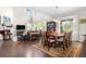 Spacious living room with high ceilings, large windows, a fireplace, and comfortable seating arrangements at 1920 Pioneer Cir, Lafayette, CO 80026