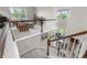 A view of the staircase leading to the living room, boasting lots of natural light at 1920 Pioneer Cir, Lafayette, CO 80026