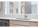 Close-up of a modern kitchen sink with stainless steel faucet and a window view at 15018 Cast Pebble Cir, Parker, CO 80134