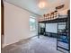This bedroom offers a metal bunkbed, a window, carpeted floors and white walls at 14665 E Stanford Pl, Aurora, CO 80015