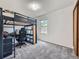 Well-lit bedroom with a study and white walls at 14665 E Stanford Pl, Aurora, CO 80015