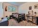 Comfortable bedroom with a bed and desk space at 14665 E Stanford Pl, Aurora, CO 80015