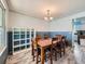 Inviting dining room featuring a large wooden table, six chairs, and ample natural light at 14665 E Stanford Pl, Aurora, CO 80015