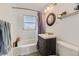 Bathroom with tub, shower, and vanity with drawers at 1164 Chester St, Aurora, CO 80010