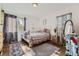 Bedroom with double bed, dresser, and wood floors at 1164 Chester St, Aurora, CO 80010