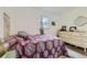 Small bedroom with a double bed and wood floors at 1164 Chester St, Aurora, CO 80010