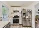 Updated kitchen with stainless steel appliances and white cabinets at 1164 Chester St, Aurora, CO 80010