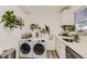 Laundry room with washer and dryer in the kitchen at 1164 Chester St, Aurora, CO 80010