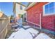 Small backyard with deck and partial snow cover at 14653 E Crestridge Dr, Centennial, CO 80015