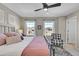 Main bedroom with a king-size bed and two windows at 14653 E Crestridge Dr, Centennial, CO 80015