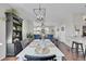 Open concept dining room with view of living room and kitchen at 14653 E Crestridge Dr, Centennial, CO 80015