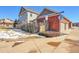 House exterior showcasing the garage and landscaping at 14653 E Crestridge Dr, Centennial, CO 80015