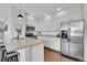 Modern kitchen with stainless steel appliances and white cabinets at 14653 E Crestridge Dr, Centennial, CO 80015