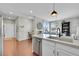 Modern kitchen with island, stainless steel appliances, and white cabinets at 14653 E Crestridge Dr, Centennial, CO 80015