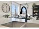 Modern kitchen sink and faucet with view into dining area at 14653 E Crestridge Dr, Centennial, CO 80015