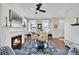 Living room with fireplace, comfortable seating, and hardwood floors at 14653 E Crestridge Dr, Centennial, CO 80015