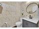 Stylish powder room with updated vanity and leaf-patterned wallpaper at 14653 E Crestridge Dr, Centennial, CO 80015