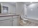 Bathroom featuring single vanity and bathtub at 16744 W 93Rd Pl, Arvada, CO 80007