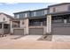 Modern townhomes with spacious garages and inviting balconies offering a blend of comfort and style at 16744 W 93Rd Pl, Arvada, CO 80007