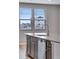 Kitchen island features stainless steel appliances, modern faucet, and view to neighborhood at 16744 W 93Rd Pl, Arvada, CO 80007