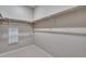 Walk-in closet with multiple bars and shelving at 16744 W 93Rd Pl, Arvada, CO 80007