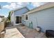 This backyard has a privacy fence, light blue siding, a sliding glass door, and a stone patio for outdoor entertaining at 13959 E 106Th Ave, Commerce City, CO 80022