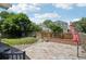 A spacious backyard featuring a stone patio, privacy fence, and well-manicured lawn offers relaxing outdoor living at 13959 E 106Th Ave, Commerce City, CO 80022