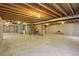 Large unfinished basement with exposed ductwork and concrete floor at 13959 E 106Th Ave, Commerce City, CO 80022