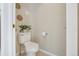 Cozy powder room features neutral paint and tile flooring at 13959 E 106Th Ave, Commerce City, CO 80022