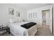 Neutral bedroom with carpet, and minimalist artwork, alongside a cozy bed setting at 13959 E 106Th Ave, Commerce City, CO 80022