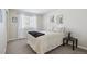 Neat bedroom with neutral decor, a comfortable bed, and a bright window at 13959 E 106Th Ave, Commerce City, CO 80022