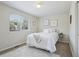 Comfortable bedroom with a plush carpet, large window, and artwork at 13959 E 106Th Ave, Commerce City, CO 80022