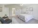 Bright bedroom features a vaulted ceiling, neutral colors, and an ensuite bathroom at 13959 E 106Th Ave, Commerce City, CO 80022