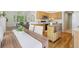 Well-lit kitchen with breakfast nook table, lots of sunlight, and a view of the living room at 13959 E 106Th Ave, Commerce City, CO 80022